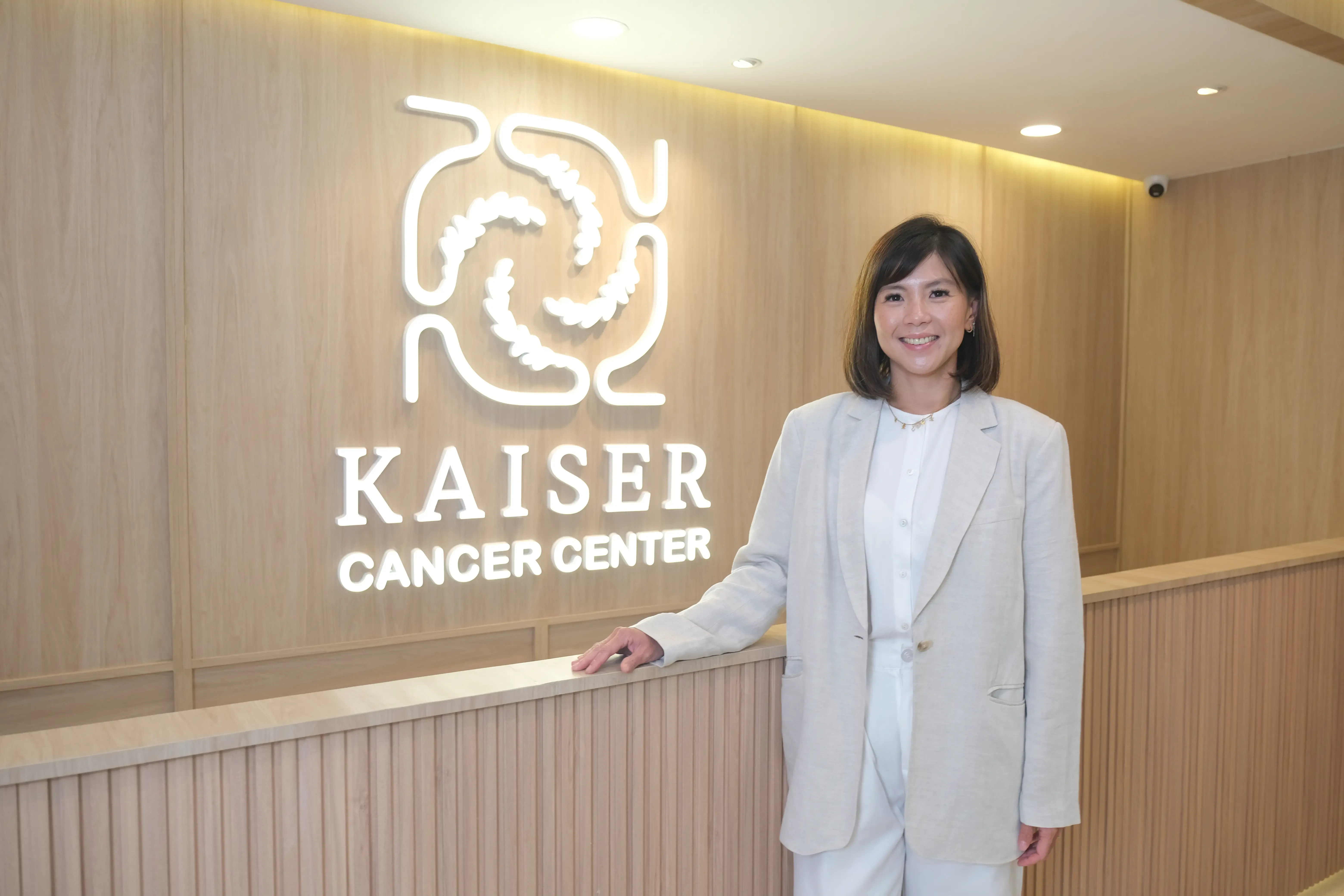 A doctor smiling at a patient at Kaiser Cancer Center A doctor smiling at a patient at Kaiser Cancer Center